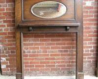 Edwardian oak fireplace surround mantel. With oval mirror